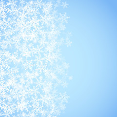 Abstract blue Christmas background with snowflakes.