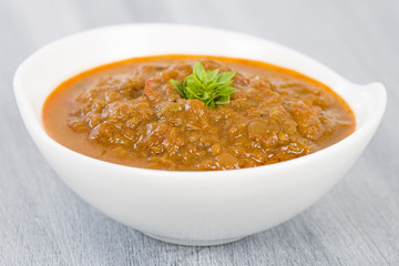 Baigan Bharta - Roasted mashed aubergines cooked with onions, tomatoes and spices. 

