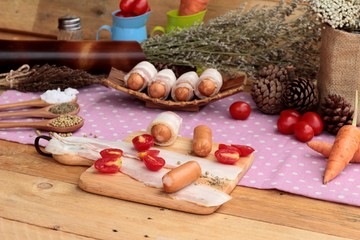  Sausages  wrapped in raw bacon fat at delicious.