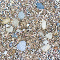 Stone and sand texture or background. Rural road close-up.