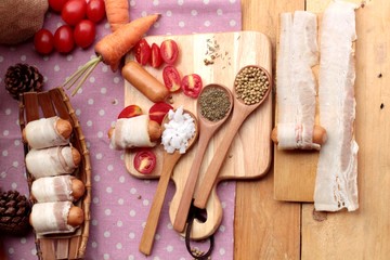  Sausages  wrapped in raw bacon fat at delicious.