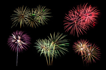 Colorful fireworks of various colors on black background