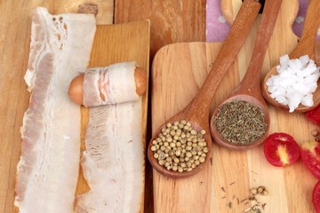  Sausages  wrapped in raw bacon fat at delicious.