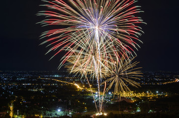 Fireworks on night city background