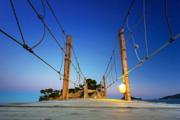 Hanging bridge to the island at night, Zakhynthos in Greece