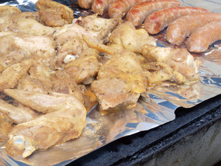 chicken and sausage on the grill