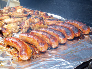 chicken and sausage on the grill