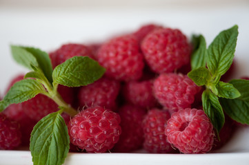 Ripe raspberry with mint