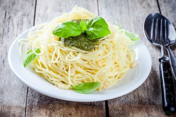 Spaghetti with pesto sauce and basil