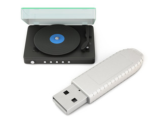Little turntable next to a large USB