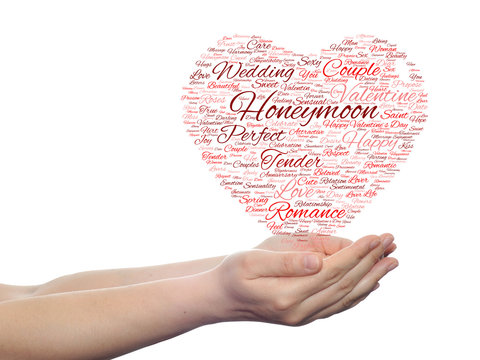 Conceptual Valentine heart word cloud in hands
