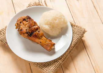 Hot Meat Dishes - Grilled chicken Legs with sticky rice on wood