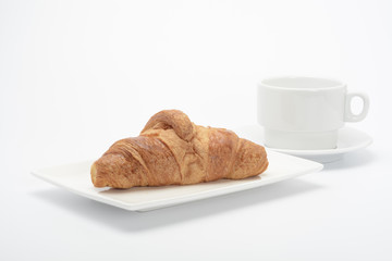 Croissant y taza