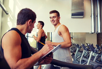 men exercising on treadmill in gym