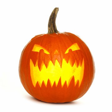 Illuminated Halloween Jack O Lantern Isolated On A White Background