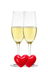 Two glasses of champagne and red hearts isolated on white backgr