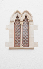 Old window with fabulous wrought, in a historic building.