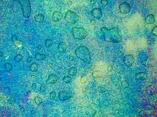 Psychedelic grunge texture with raindrops. Bright pink,green, turquoise.