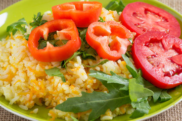 Rice with vegetables and rucola