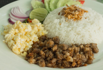 pork fried with rice and fried egg.