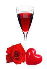 Glass with wine, heart and red rose isolated on white
