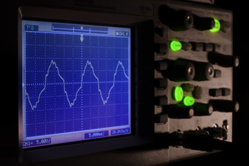 Oscilloscope at night concept with deep shadows