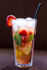 Fresh mojito drink with ice and fruit