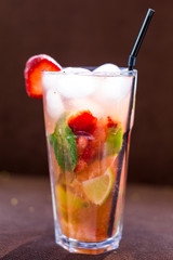 Fresh mojito drink with ice and fruit