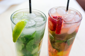 Fresh mojito drink with ice and fruit
