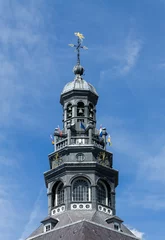 Tapeten Kerktoren tegen blauwe lucht. © mslok