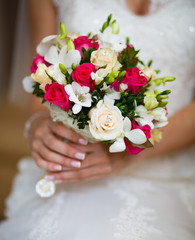 Wedding bouquet in the hands of bride