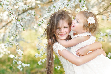 Portrait of two little girls girlfriends spring