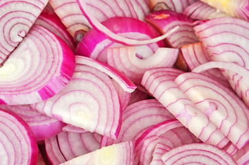 Slised red onion, close up, as background  DOF