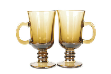 Two brown glasses isolated on the white background