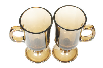 Two brown glass tea cups isolated on the white background
