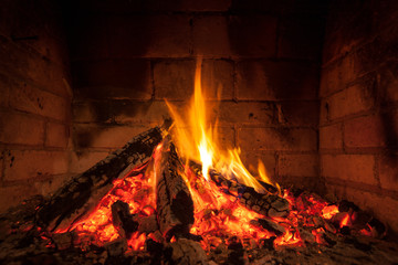 Cozy blazing fire in fireplace