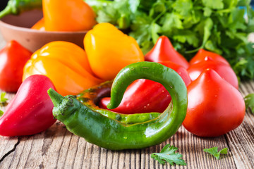 Hot green chili peppers and fresh tomatoes