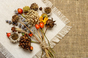 dried flowers, beige tissue,  paper
