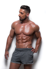 Fototapeta premium Muscular Man Wearing Gray Athletic Shorts