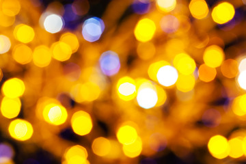 Obraz premium dark yellow and violet twinkling Christmas lights