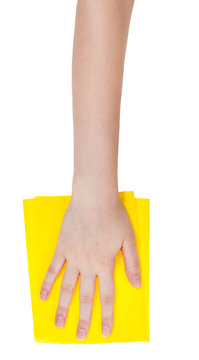 top view of hand with yellow cleaning rag isolated
