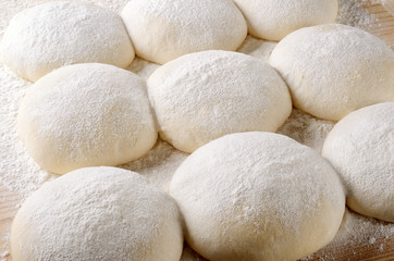 Fototapeta na wymiar Dough balls for pizza during the leavening