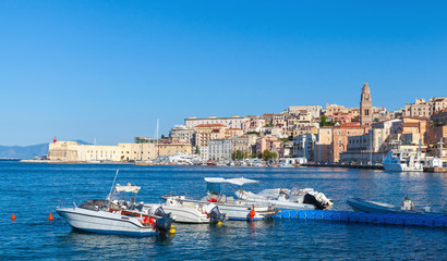Fototapeta na wymiar Pleasure motorboats for rent in bay of Gaeta