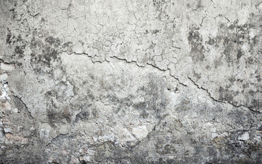 Old weathered concrete wall with damages