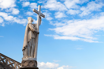 Jesus Christ statue with cross as a part of Saint Francesco Cathedral exterior. Gaeta, Italy