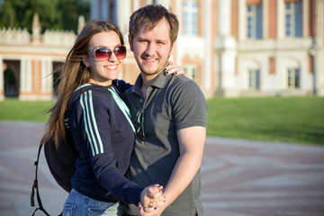 Happy tourists having fun at summer park