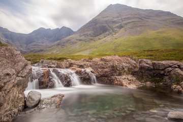 Famous Fairy Pools with Cuilin Mountains on the background, Isle of Skye, Scotland - 90421192