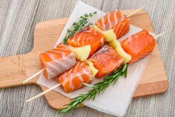 Raw salmon skewers