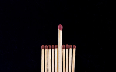 The concept of leadership, matches on a black background
