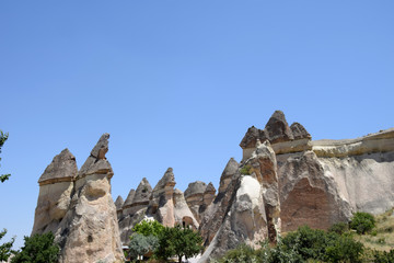 Fototapeta na wymiar Fairy Chimneys in Love Valley, Goreme National Park. Cappadocia, Turkey
